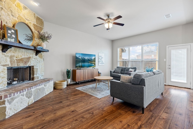 125 Singleton Dr, Royse City, TX 75189 - living area featuring hardwood / wood-style flooring, ceiling fan, and a stone fireplace
