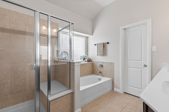 125 Singleton Dr, Royse City, TX 75189 - bathroom featuring tile patterned floors, a garden tub, a stall shower, vanity, and vaulted ceiling