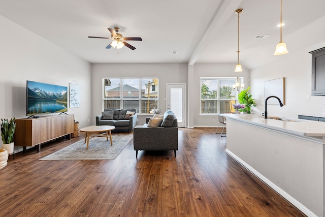 125 Singleton Dr, Royse City, TX 75189 - living room featuring dark wood-type flooring, ceiling fan, and baseboards