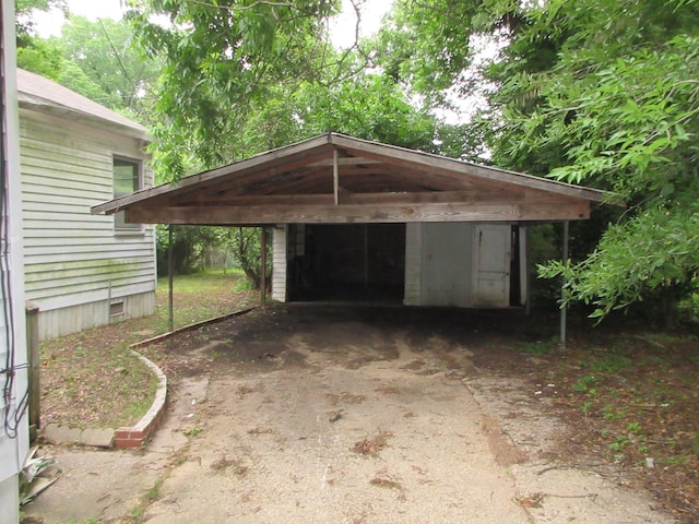 view of vehicle parking featuring a detached carport