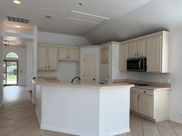 2505 Cimmaron Dr, Plano, TX 75025 - kitchen featuring stainless steel microwave, lofted ceiling, light tile patterned flooring, a center island with sink, and baseboards