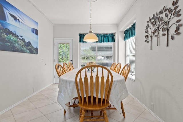 836 Stafford Station Dr, Saginaw, TX 76131 - dining area featuring plenty of natural light, light tile patterned floors, a textured ceiling, ornamental molding, and baseboards