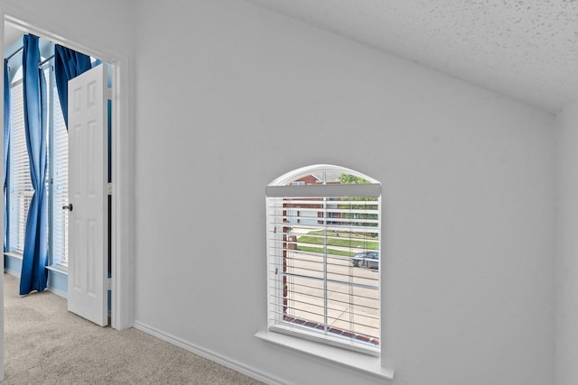 836 Stafford Station Dr, Saginaw, TX 76131 - detailed view of carpet flooring, baseboards, and a textured ceiling