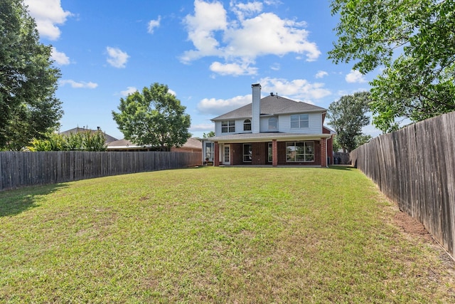 836 Stafford Station Dr, Saginaw, TX 76131 - back of property with a chimney and brick siding