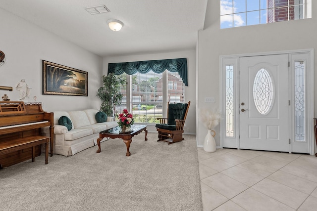 836 Stafford Station Dr, Saginaw, TX 76131 - foyer entrance with light tile patterned flooring and light carpet