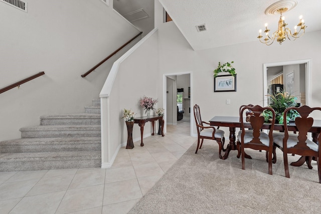 836 Stafford Station Dr, Saginaw, TX 76131 - dining room featuring stairs, a chandelier, light tile patterned floors, baseboards, and a textured ceiling
