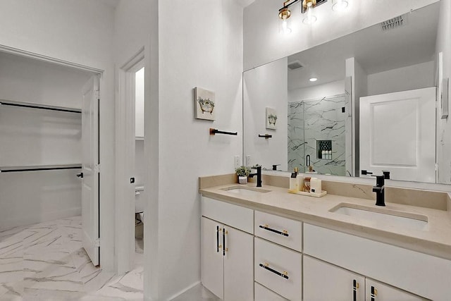 704 Witt, Wolfe City, TX 75496 - full bathroom featuring marble finish floors, a marble finish shower, baseboards, double vanity, and toilet