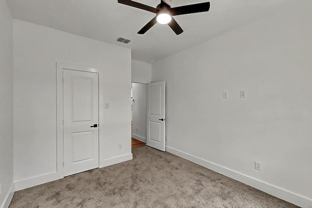 704 Witt, Wolfe City, TX 75496 - unfurnished bedroom with carpet, baseboards, and ceiling fan
