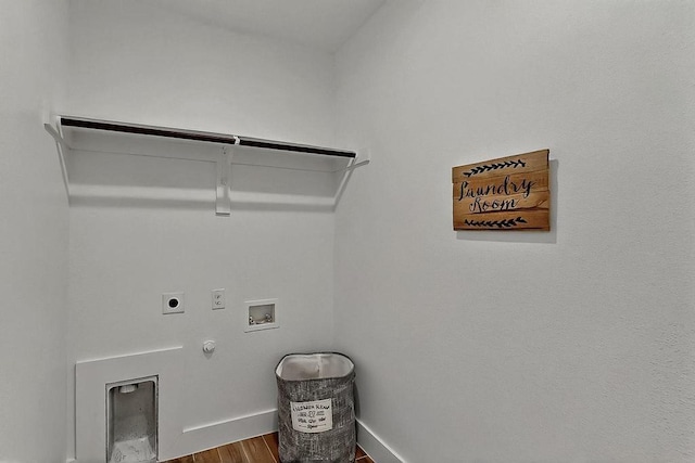 704 Witt, Wolfe City, TX 75496 - washroom featuring gas dryer hookup, hookup for a washing machine, electric dryer hookup, wood finished floors, and baseboards