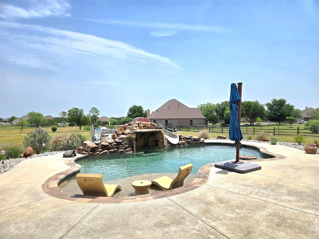 1008 Chalk Hill Ln, Haslet, TX 76052 - swimming pool with a water slide, fence, and a patio area