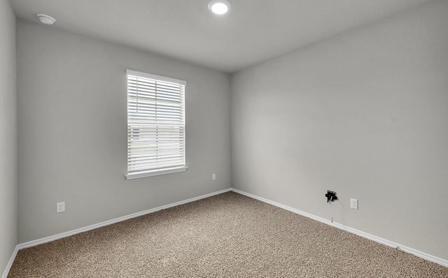 7025 Canadian Dr, Waco, TX 76633 - carpeted empty room with baseboards, a smoke detector, and recessed lighting