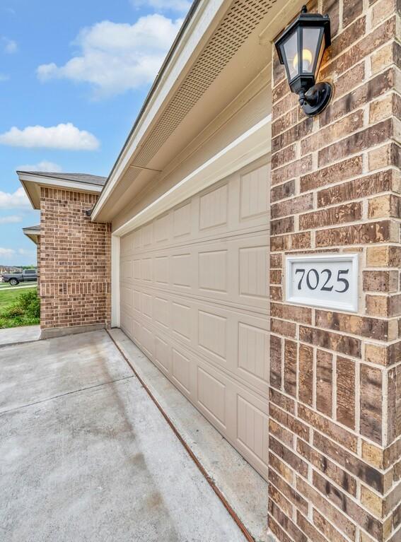 7025 Canadian Dr, Waco, TX 76633 - garage featuring driveway