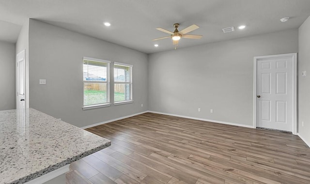 7025 Canadian Dr, Waco, TX 76633 - unfurnished living room featuring ceiling fan, wood finished floors, recessed lighting, and baseboards