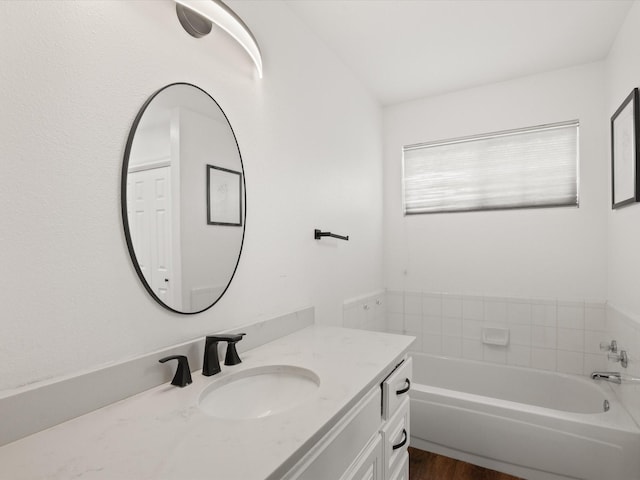 2500 Peargrove Cir, Arlington, TX 76006 - full bathroom with a garden tub, vanity, and wood finished floors