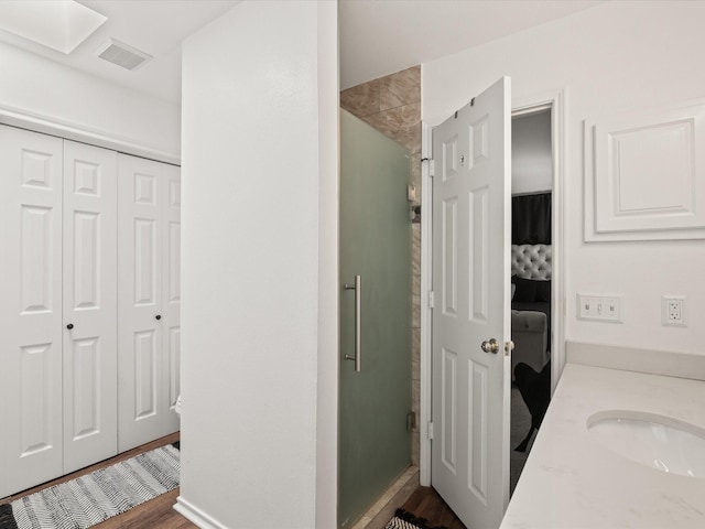 2500 Peargrove Cir, Arlington, TX 76006 - bathroom with a shower stall, wood finished floors, a closet, and ensuite bathroom