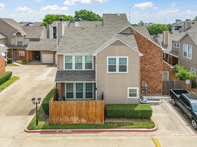 2500 Peargrove Cir, Arlington, TX 76006 - view of front facade with roof with shingles, a chimney, uncovered parking, a residential view, and brick siding
