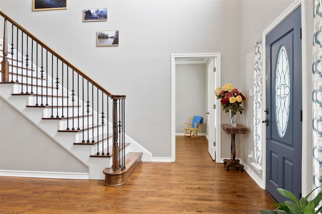 1517 Etain Rd, Irving, TX 75060 - entryway with wood finished floors, stairway, and baseboards