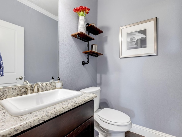7428 E Fork Ln, Mckinney, TX 75071 - half bath with toilet, baseboards, crown molding, and vanity