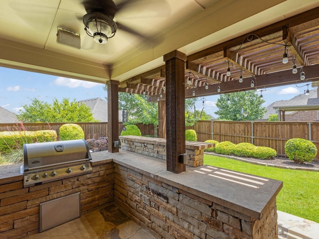 7428 E Fork Ln, Mckinney, TX 75071 - view of patio / terrace featuring grilling area, a fenced backyard, an outdoor kitchen, and a ceiling fan