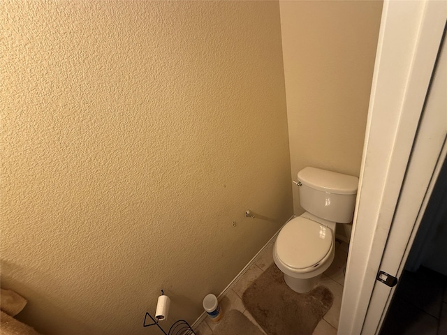 bathroom featuring tile patterned floors and toilet