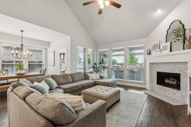 4138 Sanders Dr, Celina, TX 75009 - living room featuring a chandelier, dark wood-style flooring, healthy amount of natural light, a ceiling fan, and high vaulted ceiling