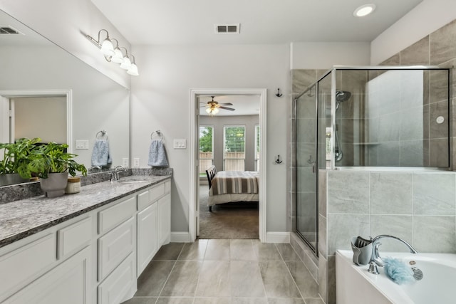 4138 Sanders Dr, Celina, TX 75009 - ensuite bathroom with vanity, a ceiling fan, a stall shower, a bath, and baseboards