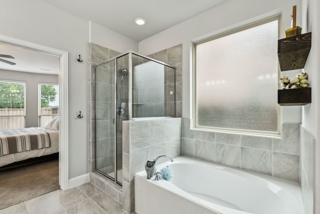4138 Sanders Dr, Celina, TX 75009 - ensuite bathroom featuring a bath, a shower stall, baseboards, tile patterned flooring, and a ceiling fan