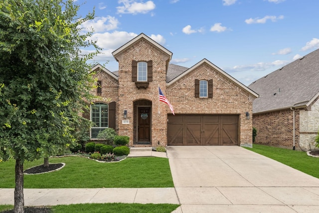 4138 Sanders Dr, Celina, TX 75009 - view of front of property with brick siding, a front lawn, driveway, and an attached garage