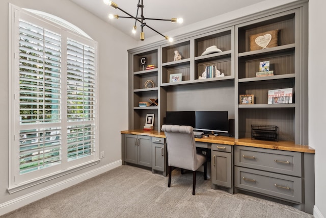 4138 Sanders Dr, Celina, TX 75009 - office space featuring built in desk, a chandelier, healthy amount of natural light, and light carpet