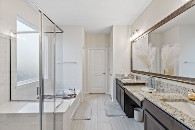 9517 Sunset Ln, Oak Point, TX 75068 - bathroom featuring double vanity, a garden tub, and a shower stall
