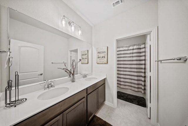 9517 Sunset Ln, Oak Point, TX 75068 - bathroom with double vanity, baseboards, tile patterned flooring, and a shower with shower curtain