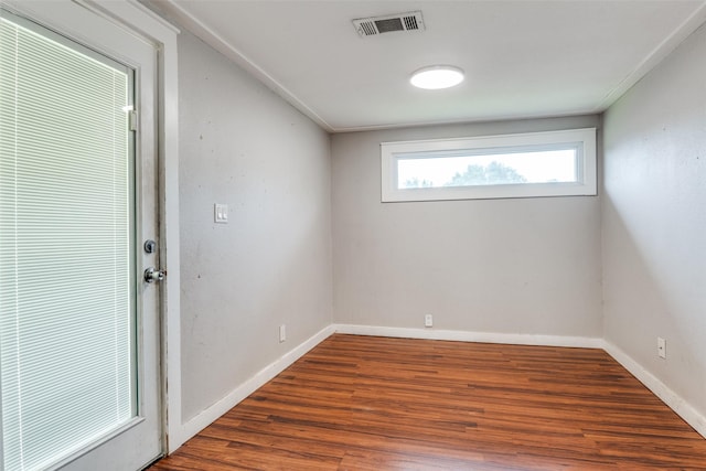 4410 Commerce St, Rowlett, TX 75088 - unfurnished room featuring wood finished floors and baseboards