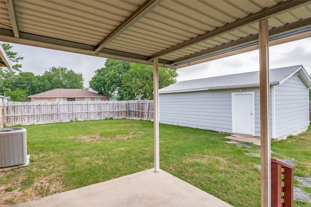 4410 Commerce St, Rowlett, TX 75088 - view of yard with a patio, central air condition unit, and an outbuilding