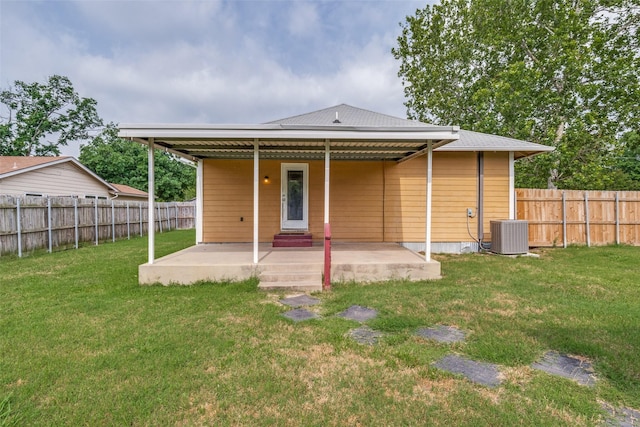4410 Commerce St, Rowlett, TX 75088 - rear view of property with a patio area and central air condition unit