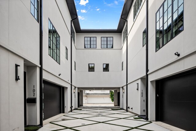 3943 Hawthorne Unit 102, Dallas, TX 75219 - exterior space featuring an attached garage