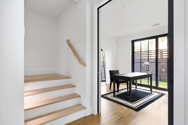 3943 Hawthorne Unit 102, Dallas, TX 75219 - stairs with wood finished floors