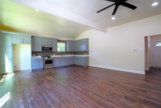 1905 S Walnut St, Sherman, TX 75090 - kitchen with appliances with stainless steel finishes, gray cabinetry, a ceiling fan, decorative backsplash, and light countertops