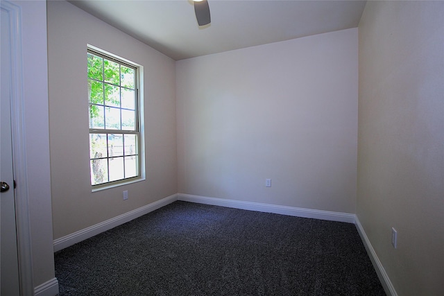 1905 S Walnut St, Sherman, TX 75090 - spare room with dark colored carpet, a ceiling fan, and baseboards