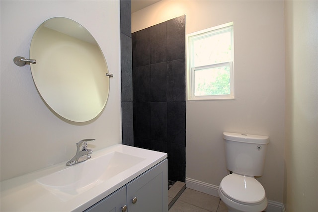 1905 S Walnut St, Sherman, TX 75090 - bathroom featuring toilet, vanity, tile patterned floors, and baseboards