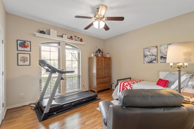 bedroom featuring light wood-style floors and a ceiling fan
