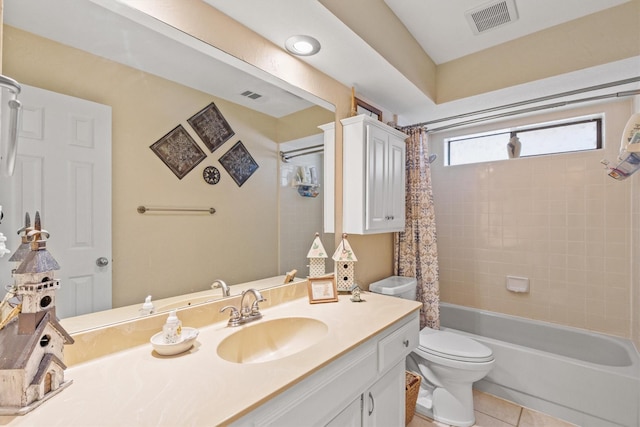 full bathroom featuring toilet, tile patterned flooring, shower / bath combo with shower curtain, and vanity