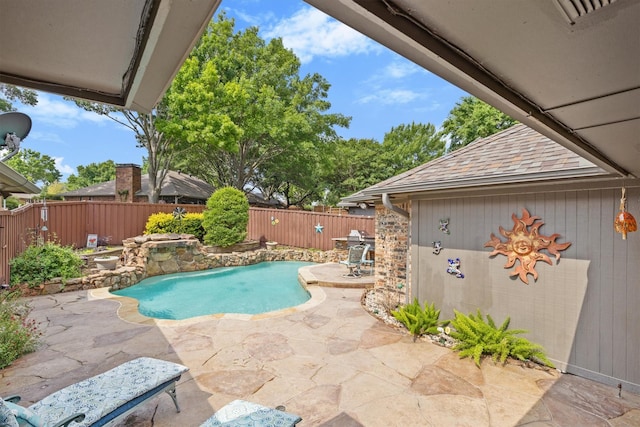 view of swimming pool featuring a patio area and a fenced backyard