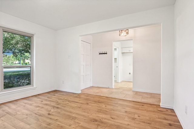 4400 Boston Dr, Plano, TX 75093 - spare room featuring light wood-style flooring and baseboards