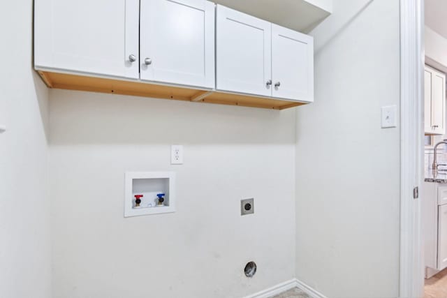 4400 Boston Dr, Plano, TX 75093 - laundry room featuring cabinet space, electric dryer hookup, washer hookup, and baseboards