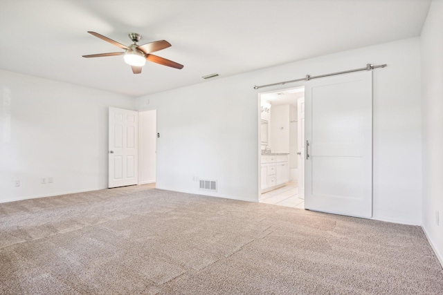 4400 Boston Dr, Plano, TX 75093 - unfurnished bedroom with light colored carpet, connected bathroom, baseboards, and ceiling fan