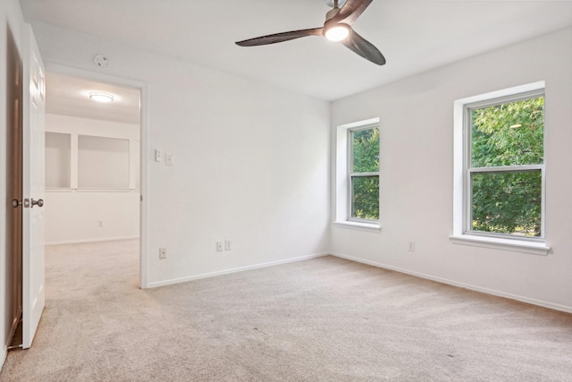 4400 Boston Dr, Plano, TX 75093 - empty room featuring light carpet, a ceiling fan, and baseboards