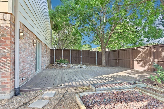 4400 Boston Dr, Plano, TX 75093 - wooden terrace featuring a fenced backyard and a vegetable garden