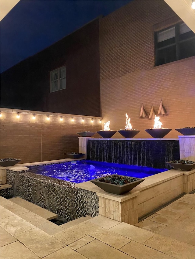 1532 Main St, Southlake, TX 76092 - pool at night with a patio area