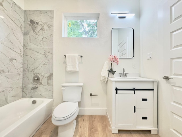 3801 Carpenter Ave, Dallas, TX 75210 - bathroom featuring wood finished floors, toilet, vanity, baseboards, and shower / bathtub combination