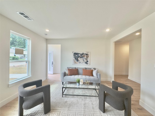 3801 Carpenter Ave, Dallas, TX 75210 - living room with recessed lighting, baseboards, and light wood finished floors